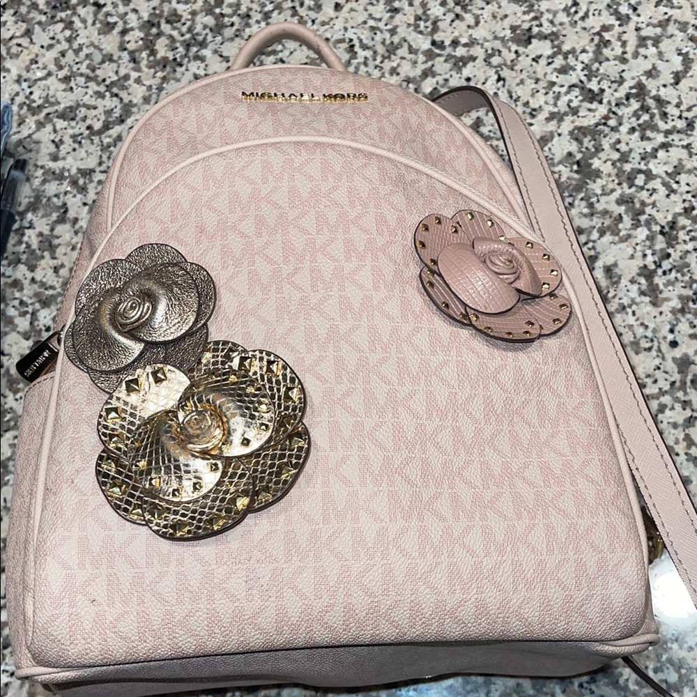 Michael Kors Abbey medium pink signature logo floral applique backpack.